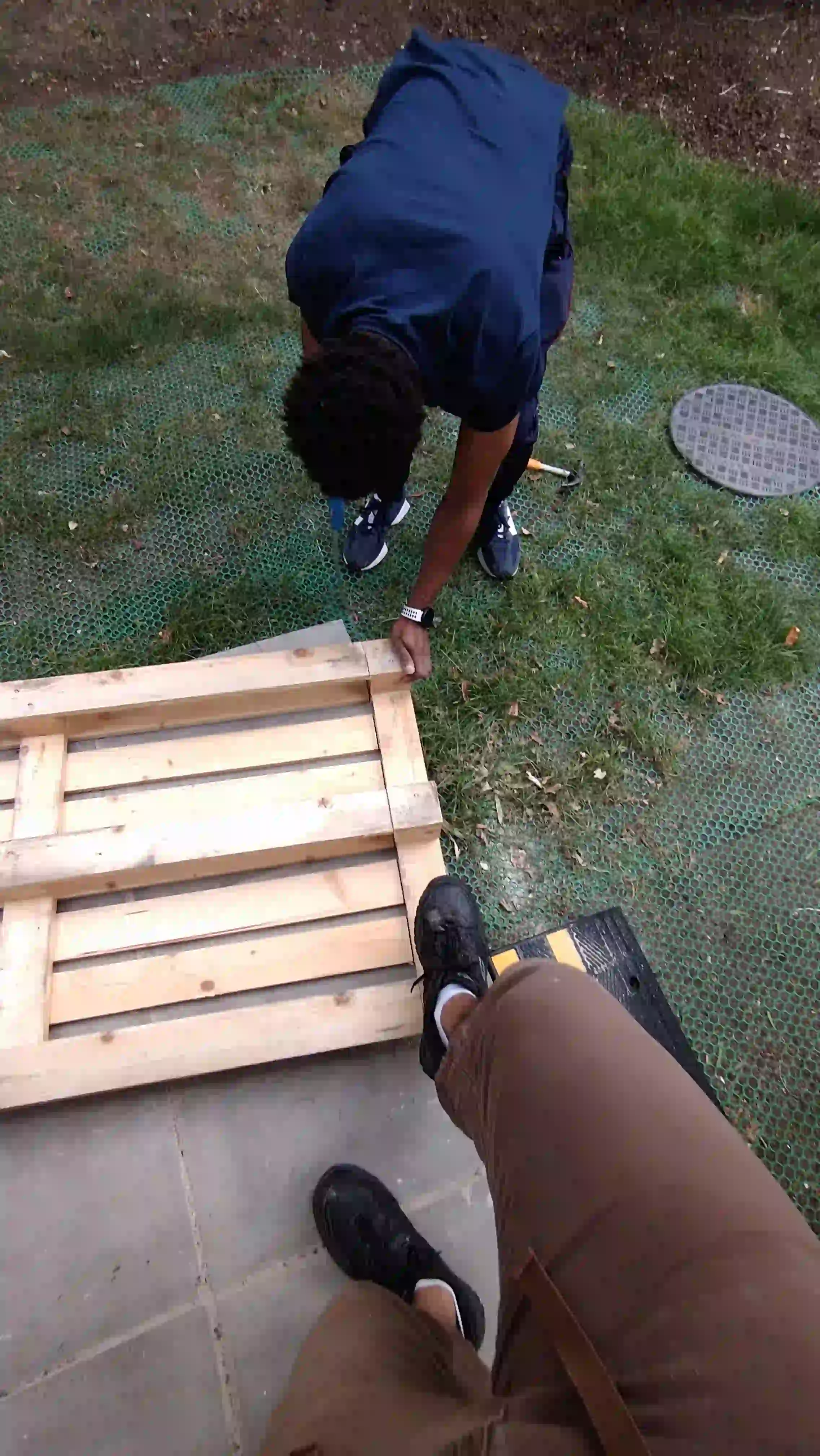 Man hammering pallet